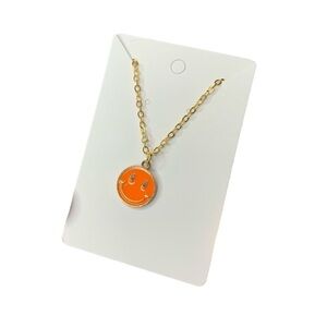 Orange and gold smiley face necklace